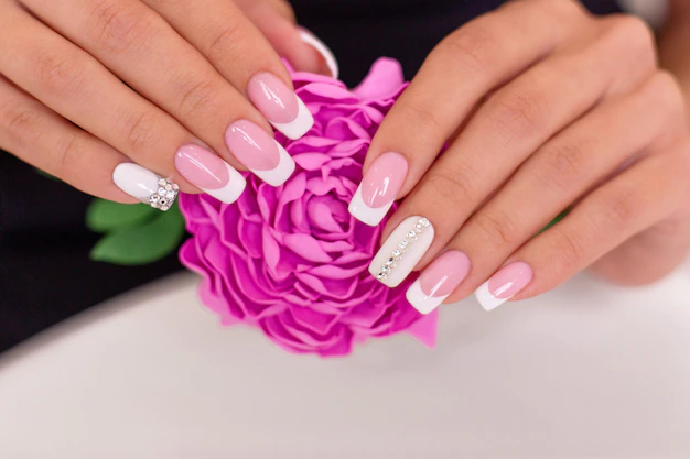 beautiful-female-hands-with-french-manicure_285484-210